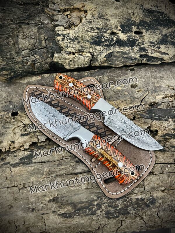 IMG-20231219-WA0000 Custom Handmade Damascus Steel Cowboy Skinner Knives Pair with Leather Sheaths - Resin & Pinecone Handle - 7.5" Length - Razor Sharp Blades - Free Personalization - Image 1